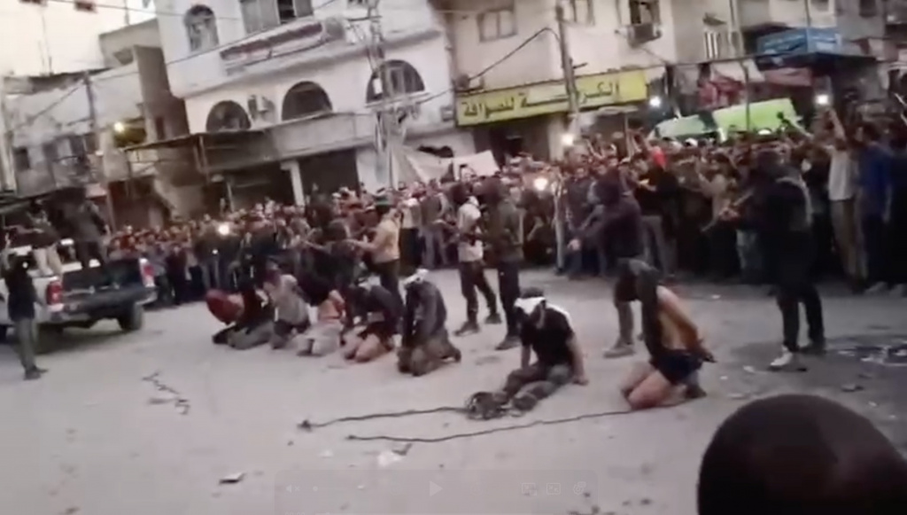 showing-masked-militants-appearing-execute-113439681_bfb0ef.jpg